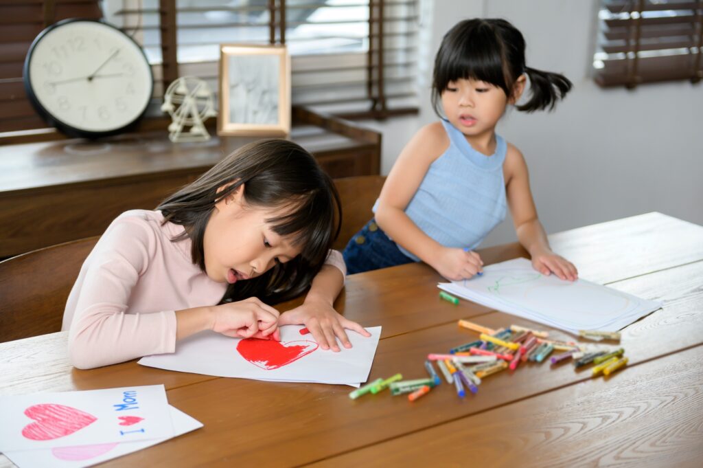 Asian children Drawing and painting on table