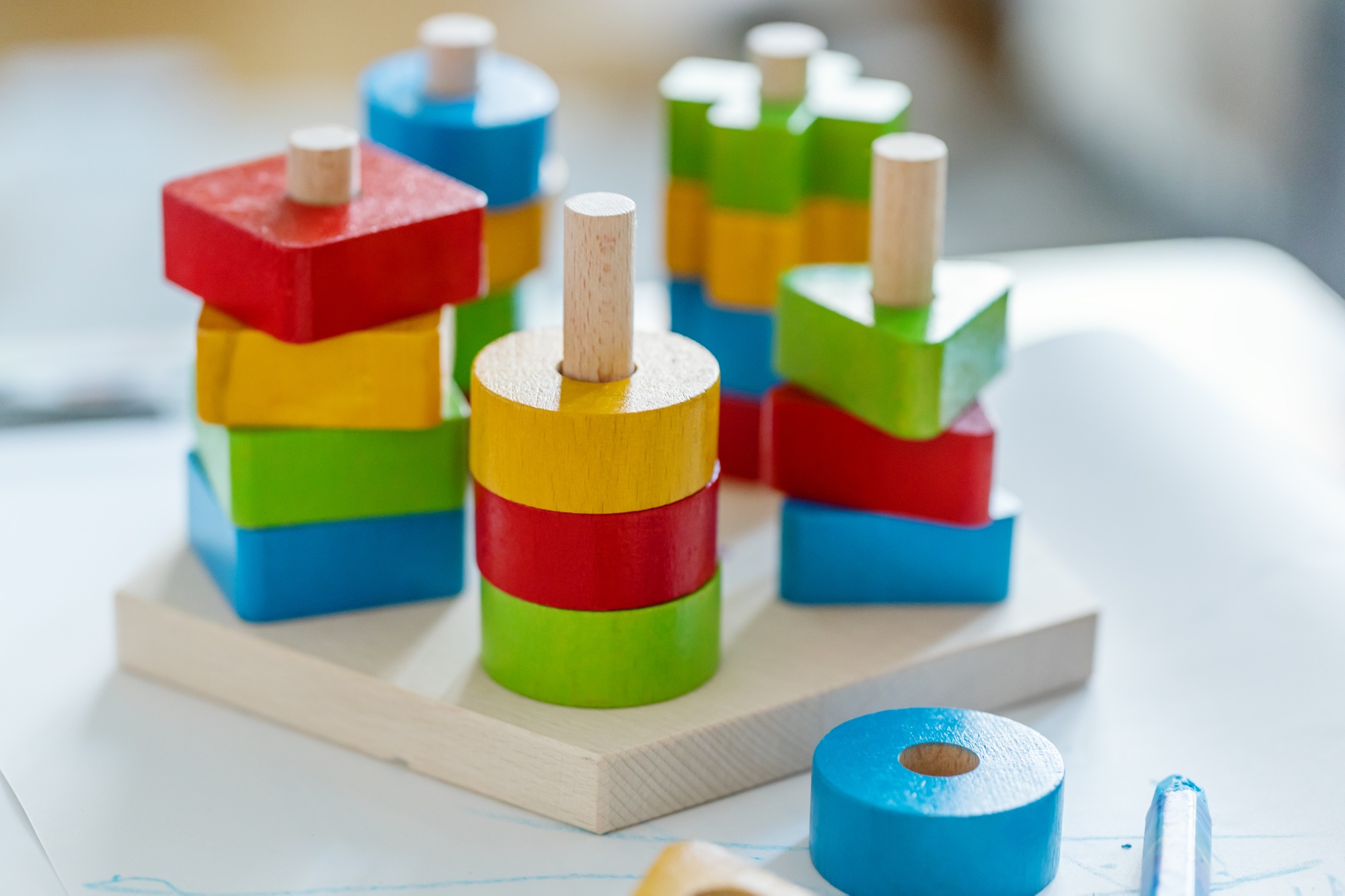 Children background with toys on blue wooden